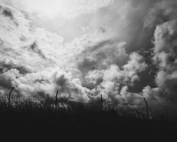 Scenic view of landscape against cloudy sky