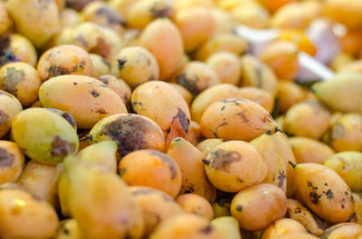 Full frame shot of plums for sale at market stall