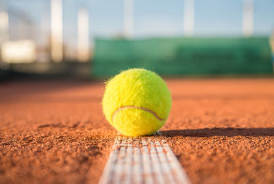 Close-up of tennis ball on field