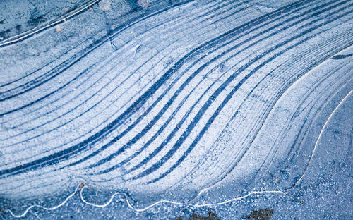 Beautiful close-up of a frozen ice formations on the water surface. natural winter texture.