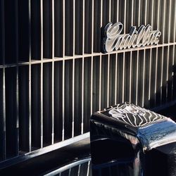 Close-up of metal railing against wall