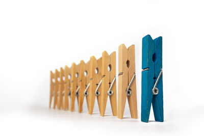 Close-up of clothespins against white background