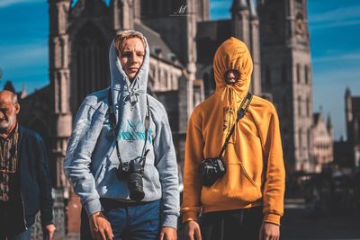 Man with women standing in city
