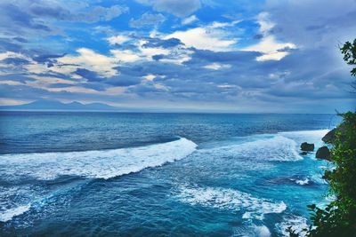 View of calm sea against cloudy sky