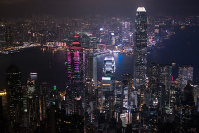 High angle view of illuminated city buildings at night