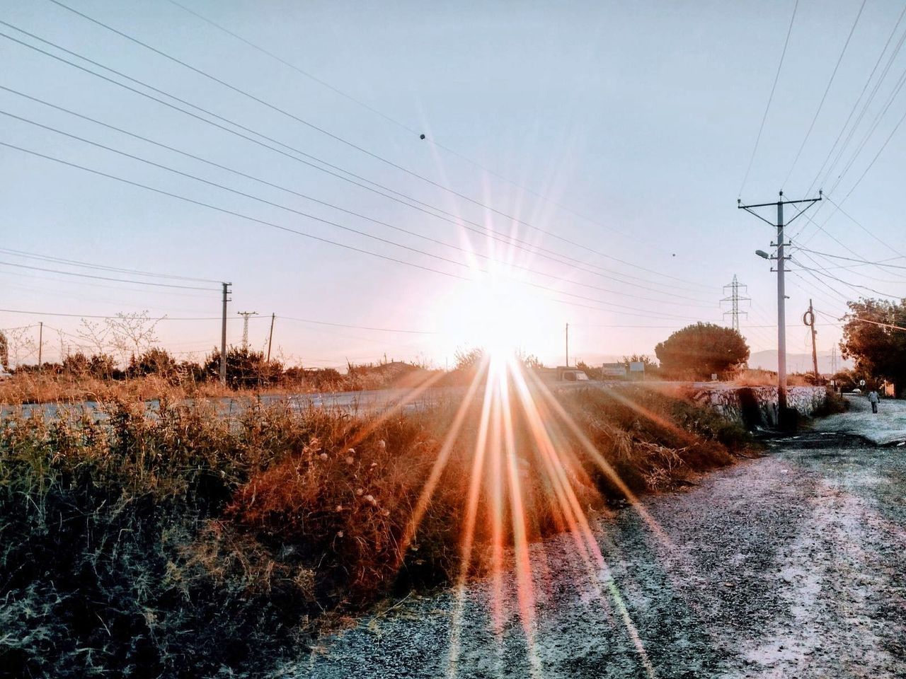 cable, electricity, sky, power line, technology, electricity pylon, sunlight, nature, power supply, sunbeam, sun, fuel and power generation, connection, lens flare, plant, beauty in nature, no people, landscape, transportation, sunset, outdoors, bright, telephone line