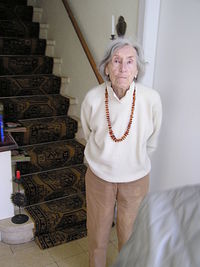 Mid adult woman standing at home