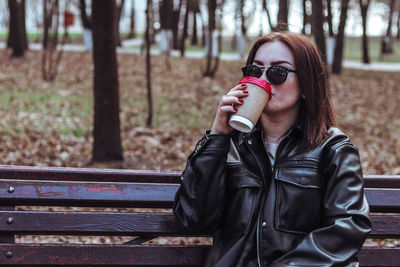 Portrait of young woman in park