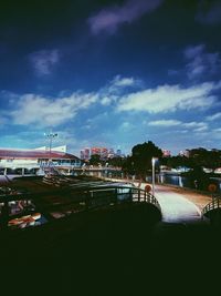 Scenic view of buildings and trees against sky