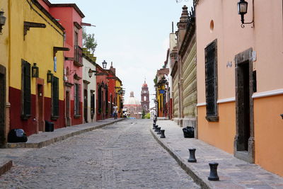 Narrow street amidst buildings in town