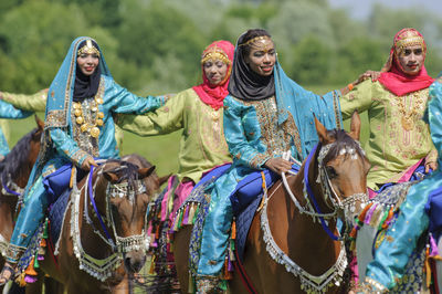 Rear view of people riding