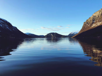 Scenic view of lake against blue sky