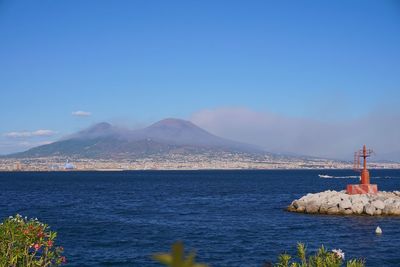 Scenic view of sea against clear blue sky