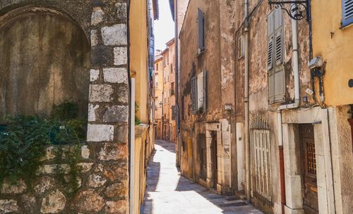 Narrow alley amidst buildings in town