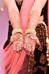 Low section of woman with hands