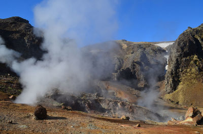 Hot steam billowing up from the volcanic landscape of hveragerdi.