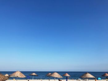 Panoramic view of sea against clear blue sky