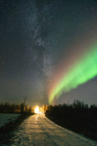 Scenic view of landscape against sky at night