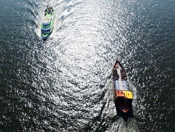 High angle view of sailboat sailing in sea