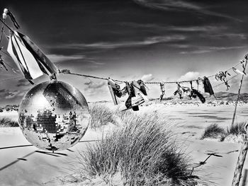Close-up of snow on mountain against sky