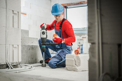 Side view of man working at construction site