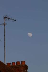 Low angle view of moon against sky