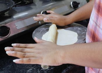 Midsection of man preparing food at home