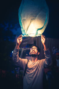 Portrait of a young man in the dark