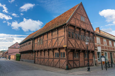 Downtown in a smaller town there is an old half timbered building that is kept in pristine condition