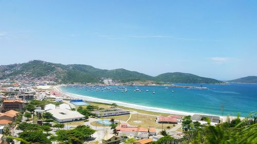 High angle view of tourist resort by sea against sky