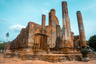 Low angle view of old temple building against sky