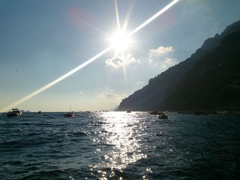 Scenic view of sea and vapor trails in sky