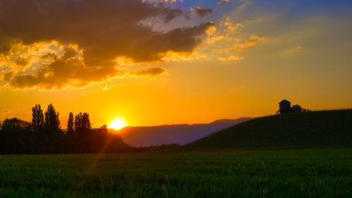 Scenic view of sunset over land