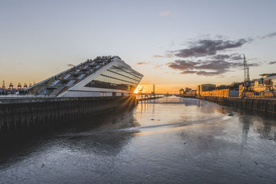 Germany, hamburg, elbe river and dockland ferry terminal at sunrise