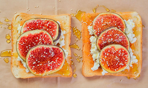 Sourdough wheat toast with ricotta cheese, fresh figs with honey and sesame seeds 