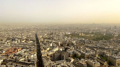High angle view of city buildings against clear sky