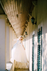 Bride standing in corridor