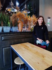 Portrait of woman working at store