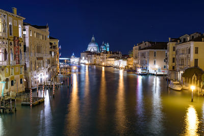 Illuminated buildings in city at night