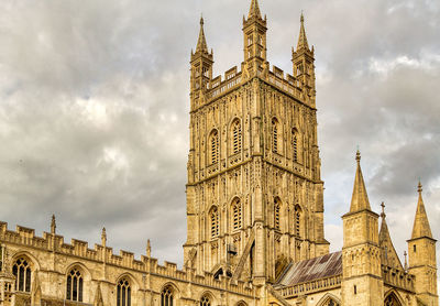 Low angle view of clock tower against sky in city