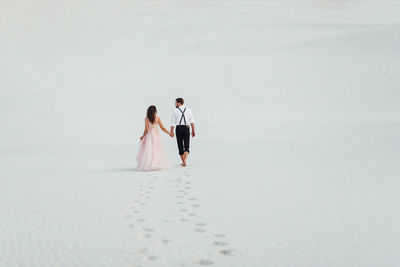 Couple walking on beach