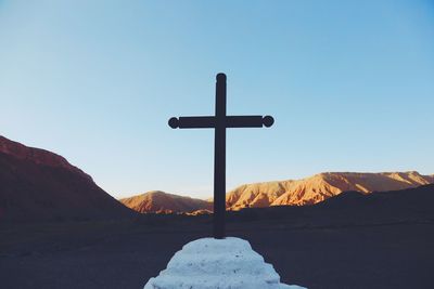 Cross with sky in background