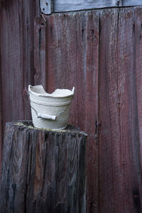 Close-up of clothes drying on wooden wall