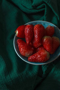 There are some delicious sweet and sour fresh strawberries on the plate