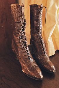 High angle view of shoes on hardwood floor