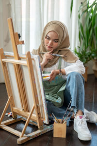 Young woman using laptop at home