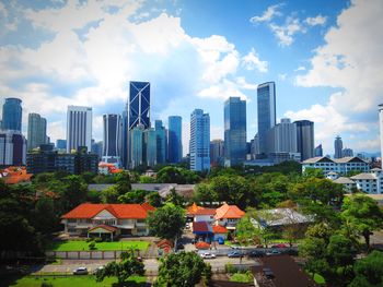 Cityscape against cloudy sky