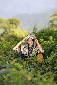 Portrait of girl wearing mask on field