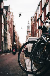 Close-up of bicycle on city street