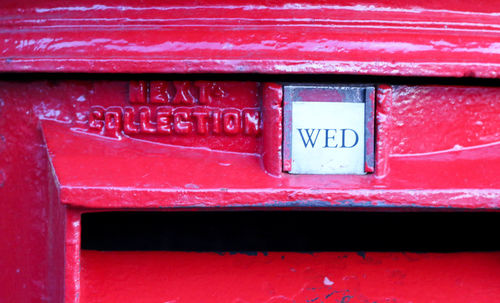 Close-up of red text on wall